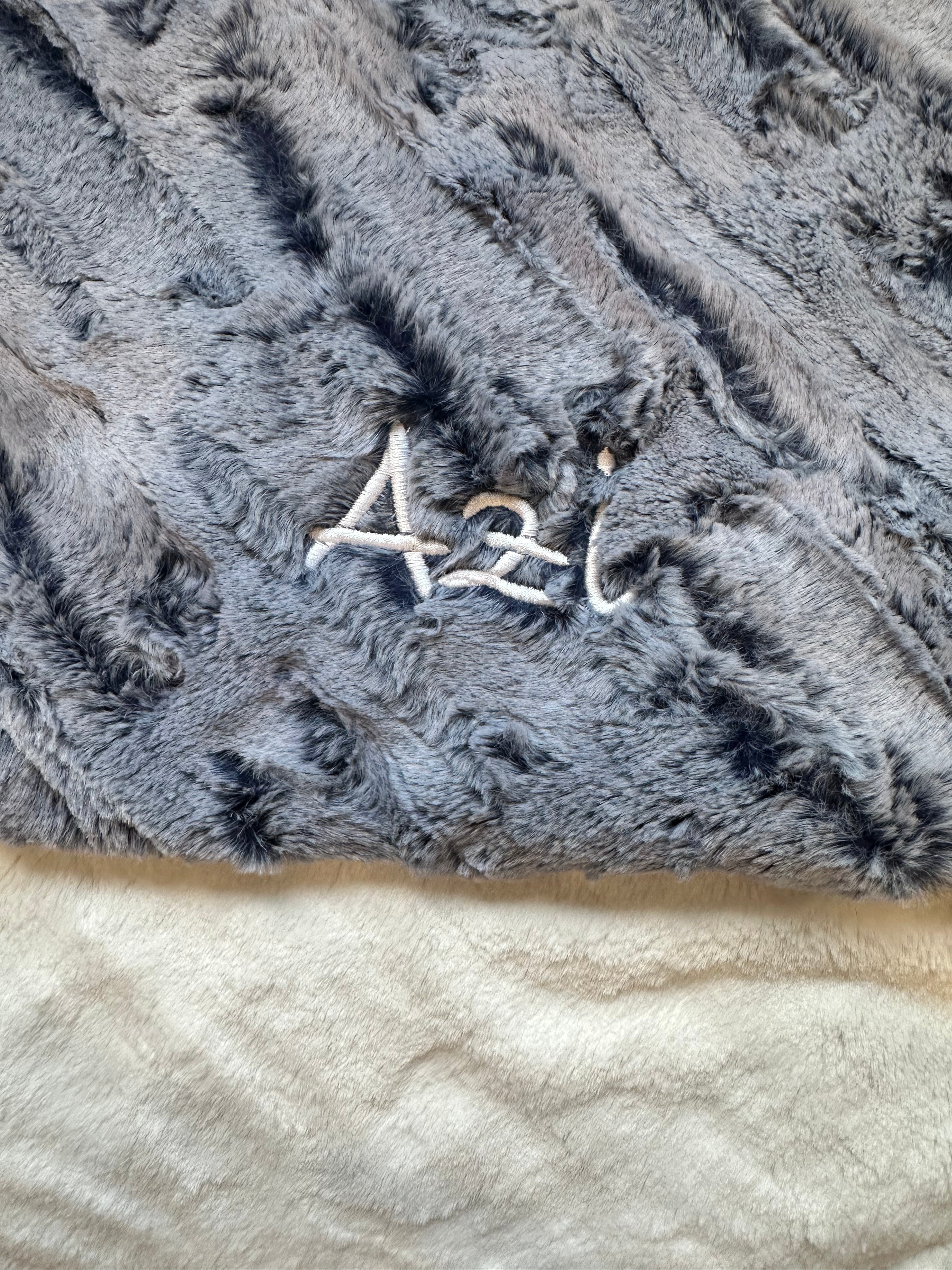 Soft plush denim blue baby blanket with snowflake texture